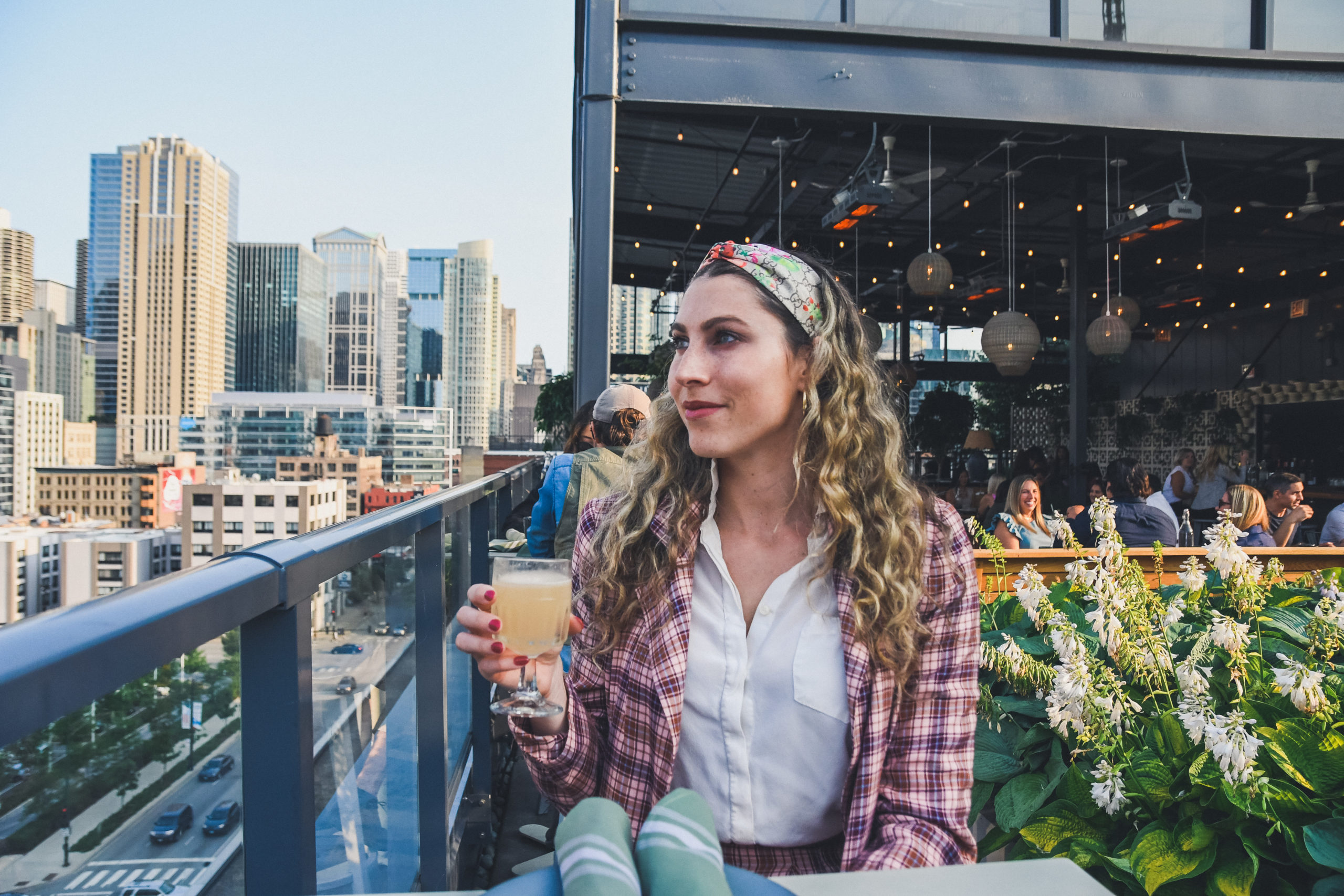 Bar Avec in Chicago, woman looks out at skyline