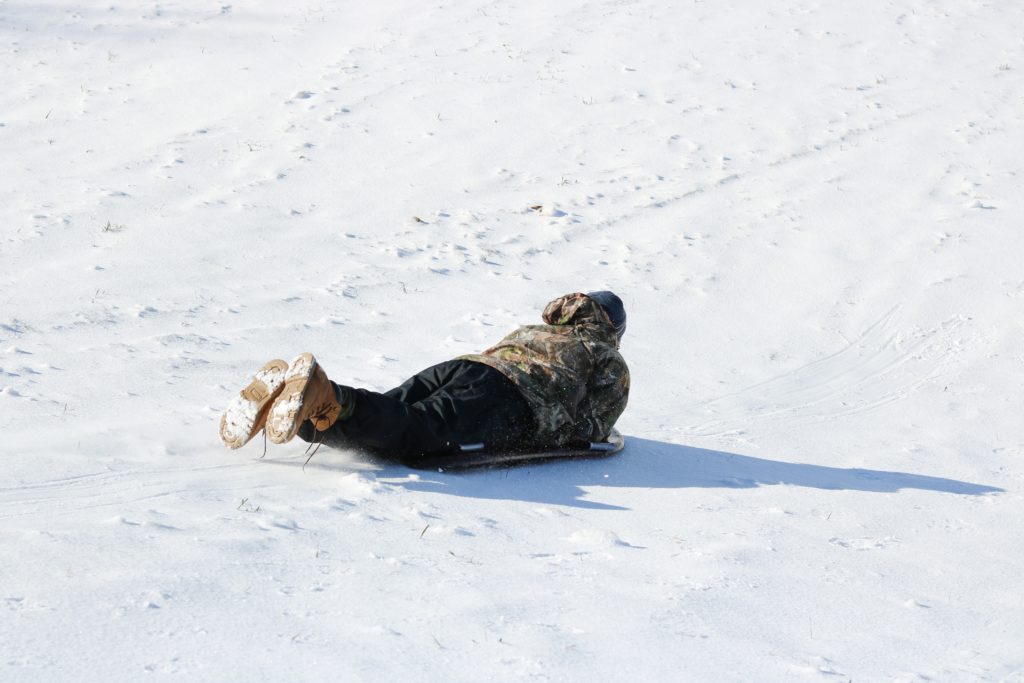 man sledding