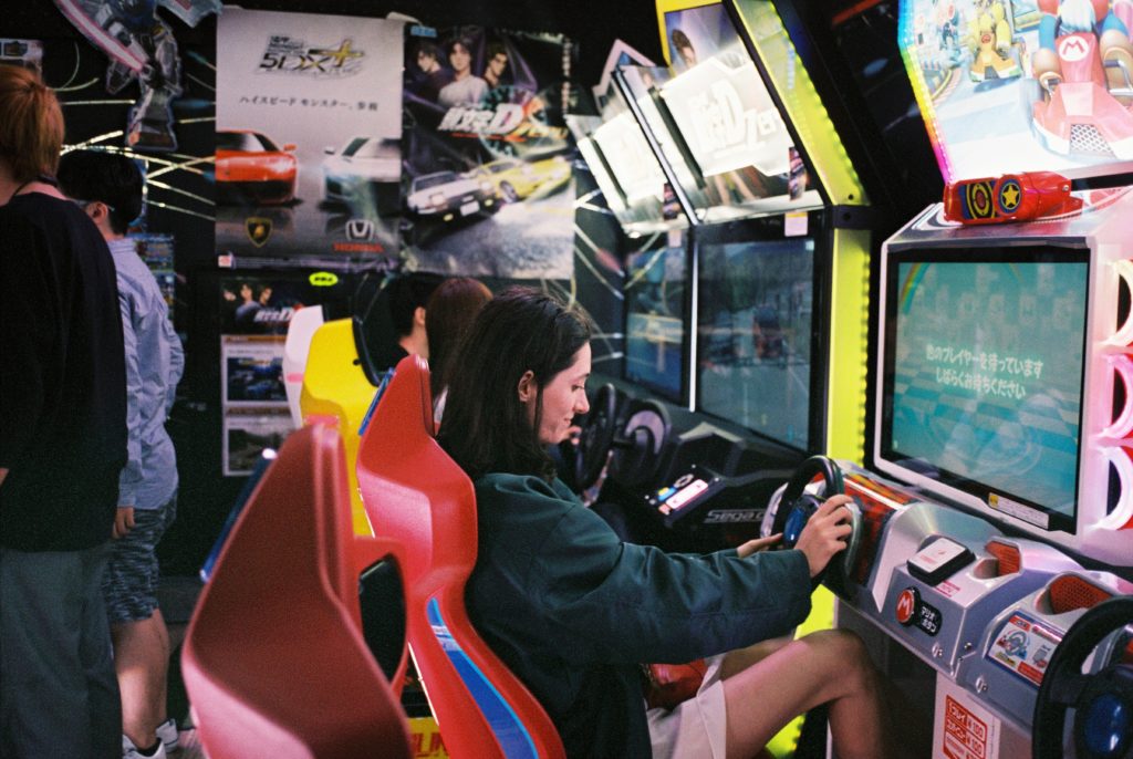 woman plays arcade games