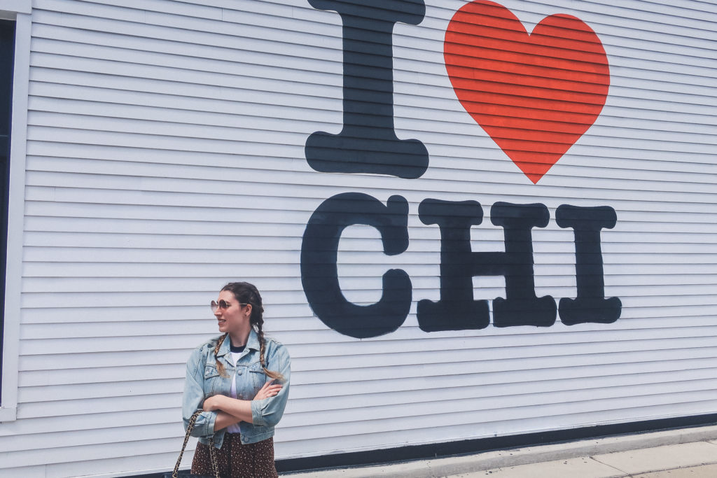 woman stands in front of Wicker Park Mural in Chicago, 'I love Chi"