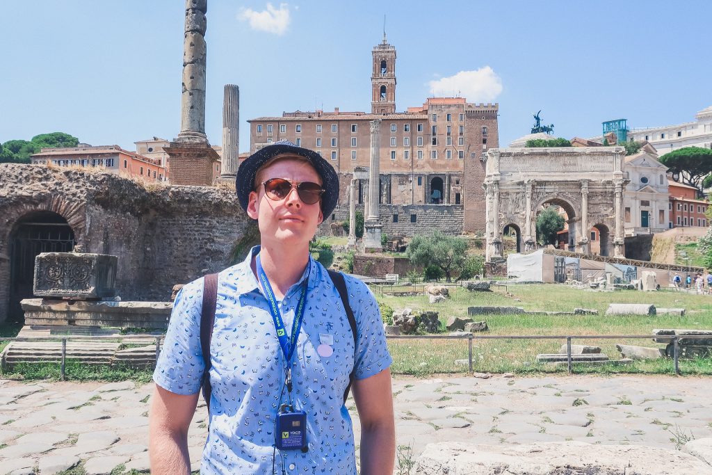 man explores Roman Forum on a sunny day