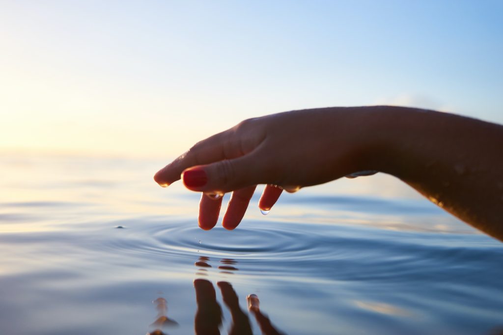 hand resting on water