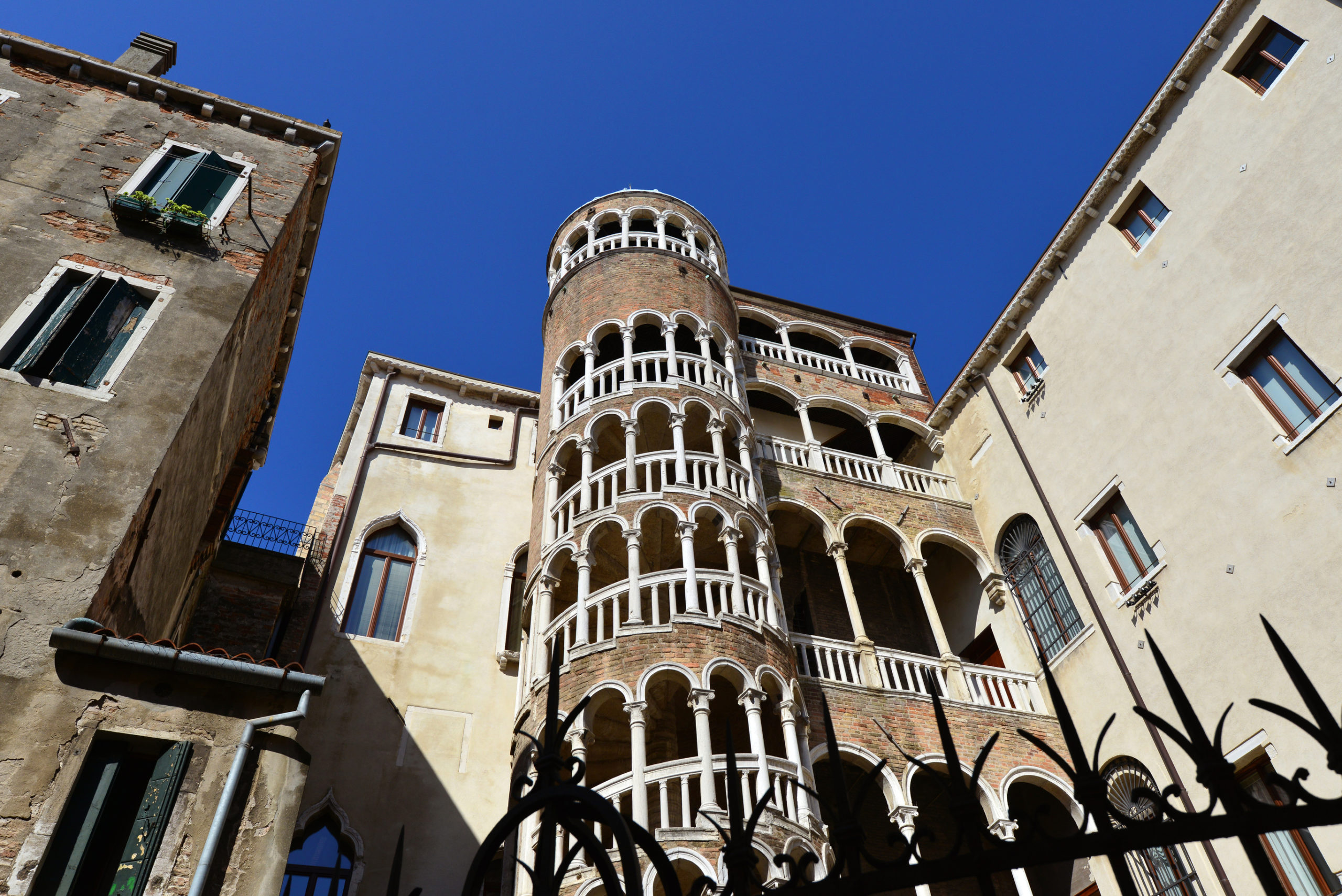 Beautiful renaissance spiral staircase in the center of Venice, one of the most famous tourist attraction in the city, seen from below