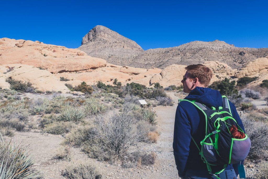 man hiking in Las Vegas desert at Red Rock State Park