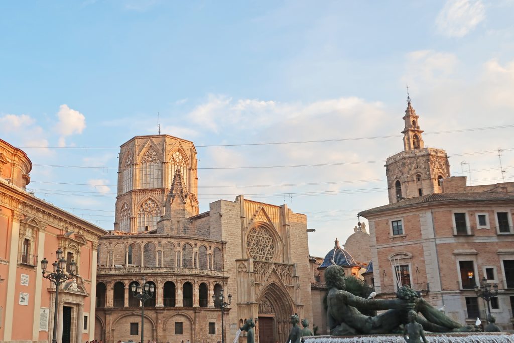 Plaza de la Virgen with part of the Turia Fountain in front and the Valencia Cathedral behindof the