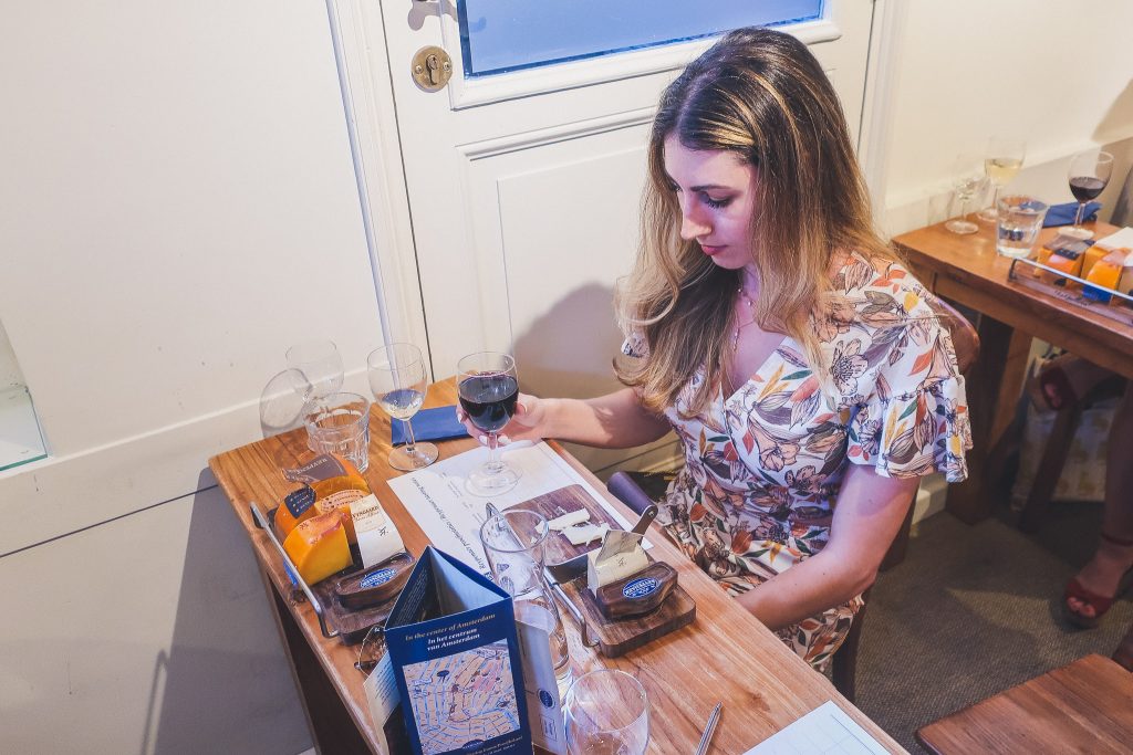 Girl sampling cheese at Reypenaer 