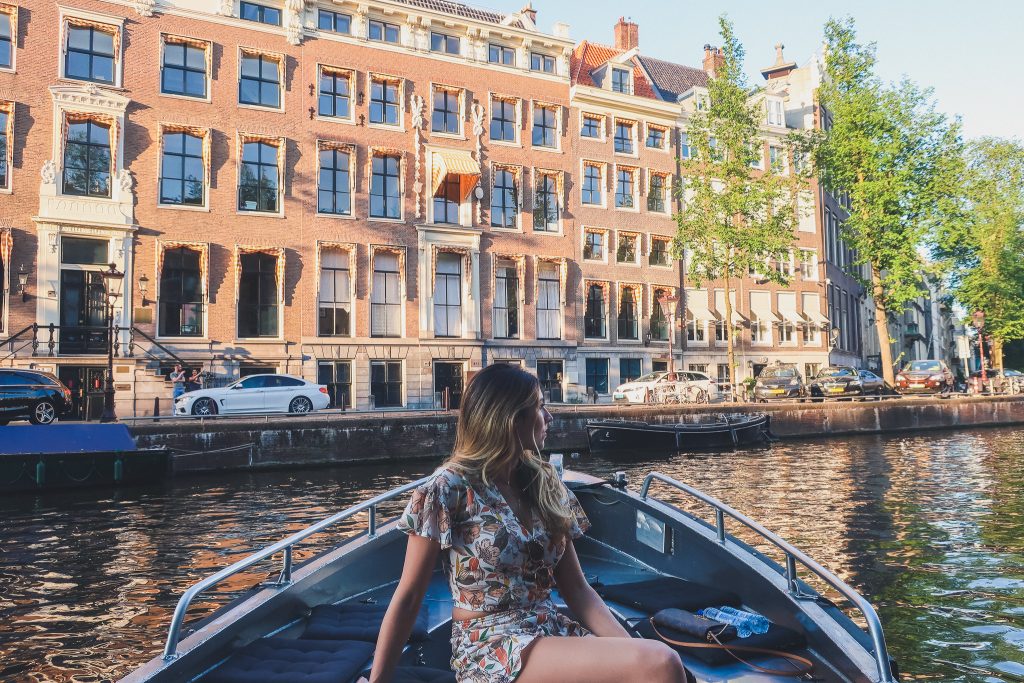 Girl on boat in Amsterdam's canals