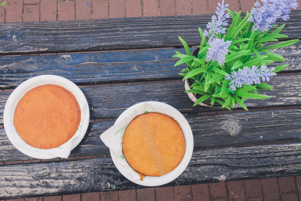 two stroopwafels on picnic bench