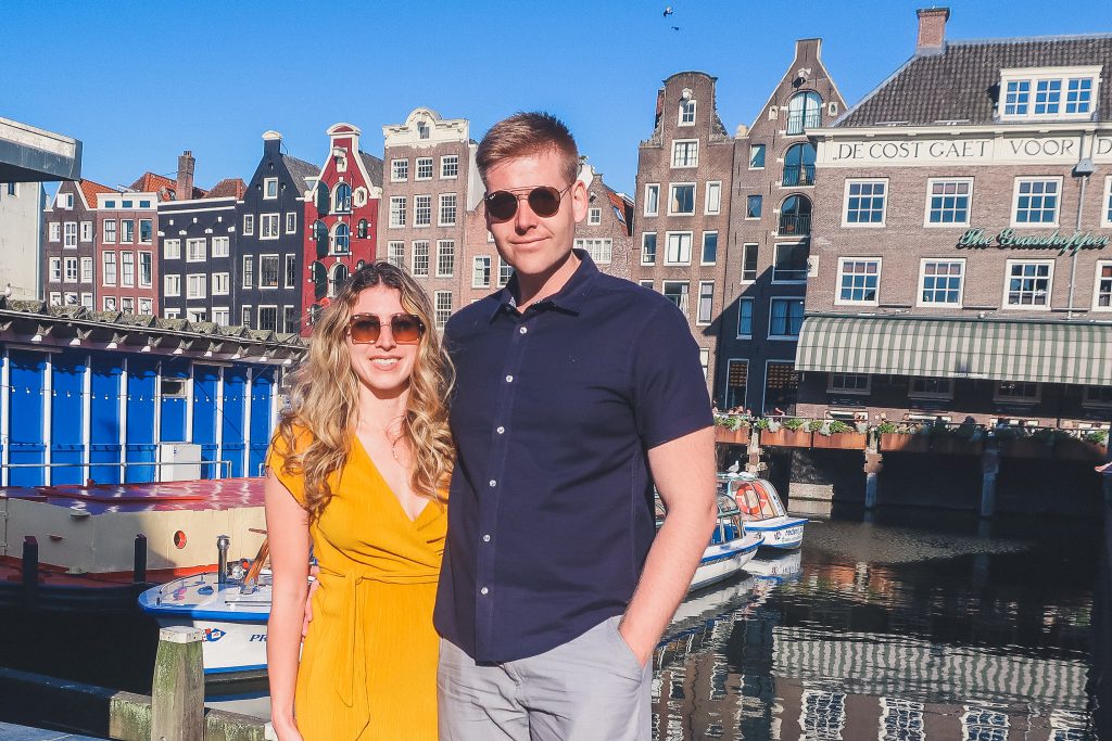 Couple in front of Amsterdam's most known Dancing Houses 