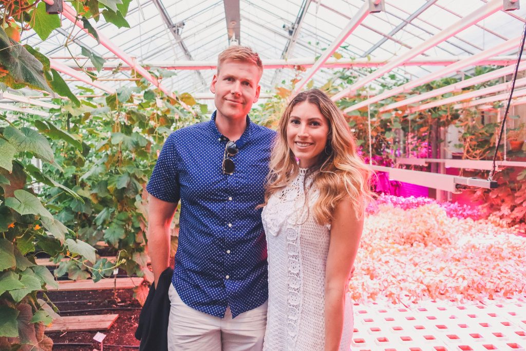 couple standing in the greenhouse of restaurant de kas in Amsterdam