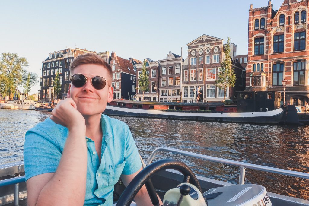 Boy on boat in Amsterdam Canals 