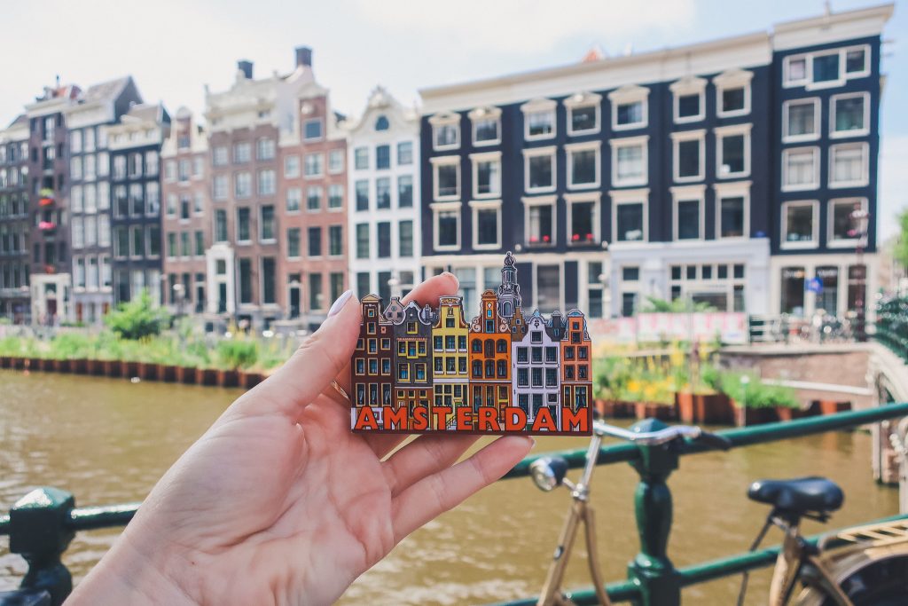Amsterdam magnet in front of amsterdam canal houses