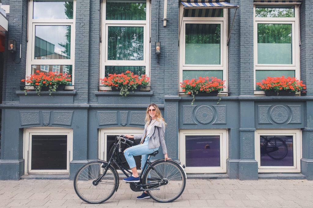 Girl riding a bike in Amsterdam 