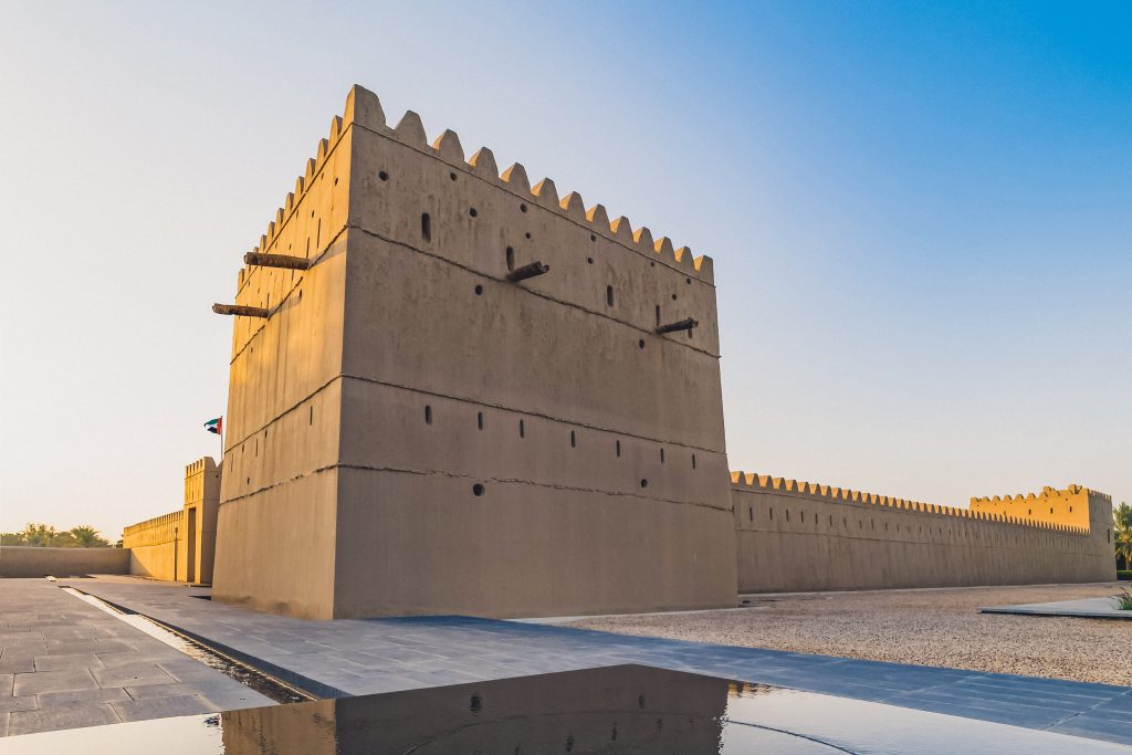 Qasr Al Muwaiji, Al Ain, United Arab Emirates - Jan.5, 2018: The Palace of His Highness Sheikh Khalifa bin Zayed Al Nahyan, President of the UAE – has been restored and reopened to the public as a museum and permanent exhibition. View of the Restored Defensive Tower and Modern Fountain