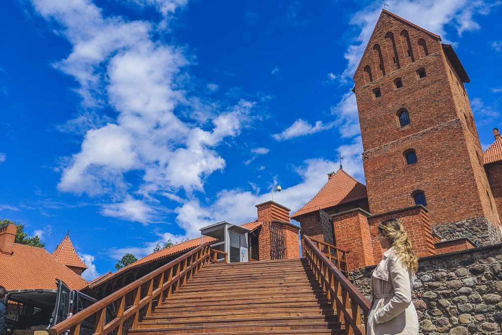 Girl in front ofTrakai Island Castle in Lithuania 