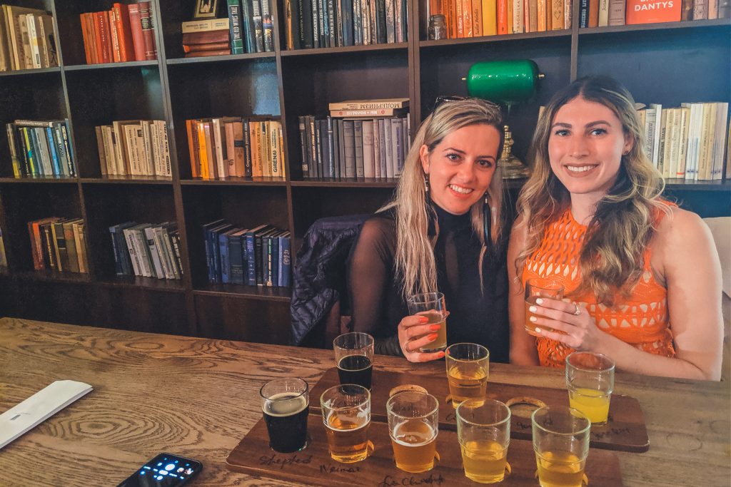 Two girls with flights at the Beer Library in Vilnius