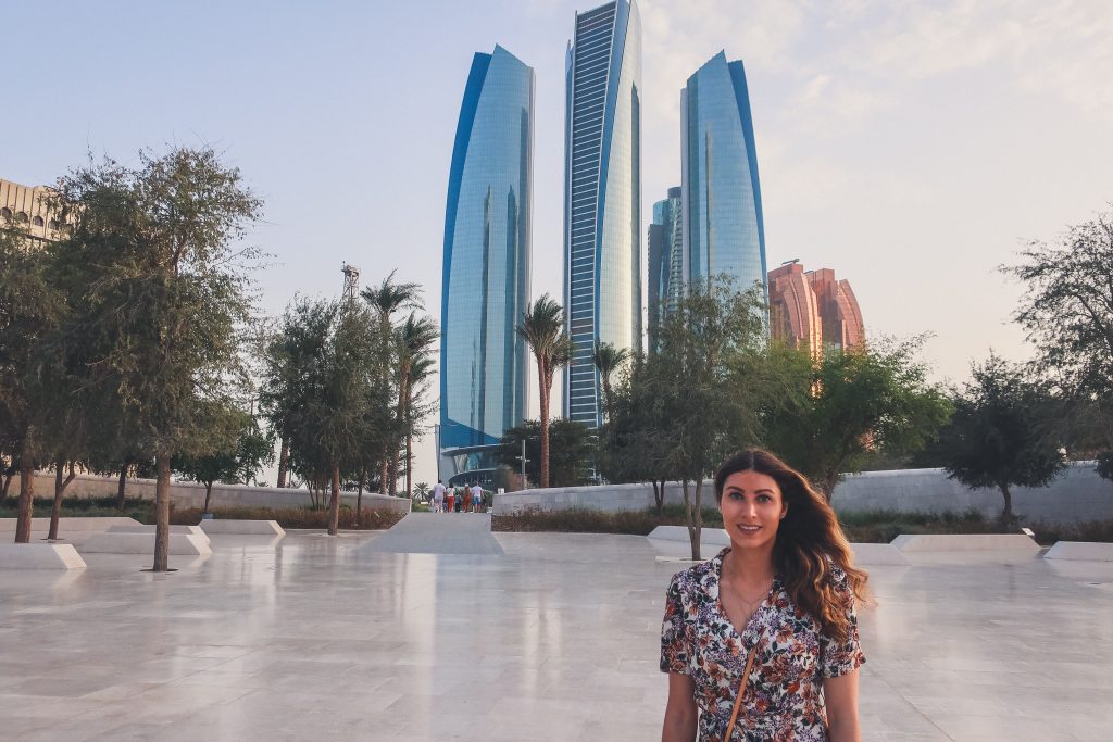 girl standing in front of etihad towers 