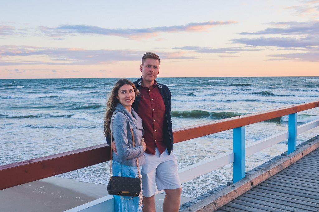  Couple standing on Palanga Pier at sunset