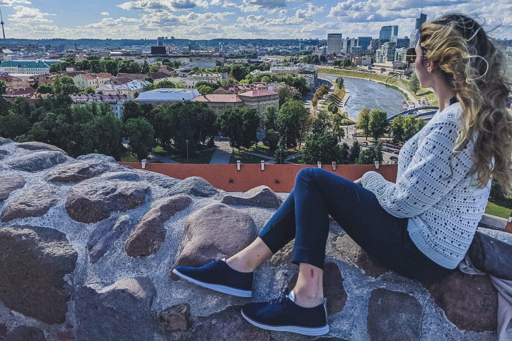 Girl looks out at vilnius from hill near Gediminas Castle