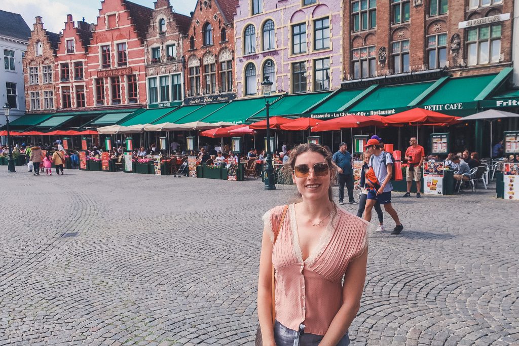 Girl standing in Bruges Market Square