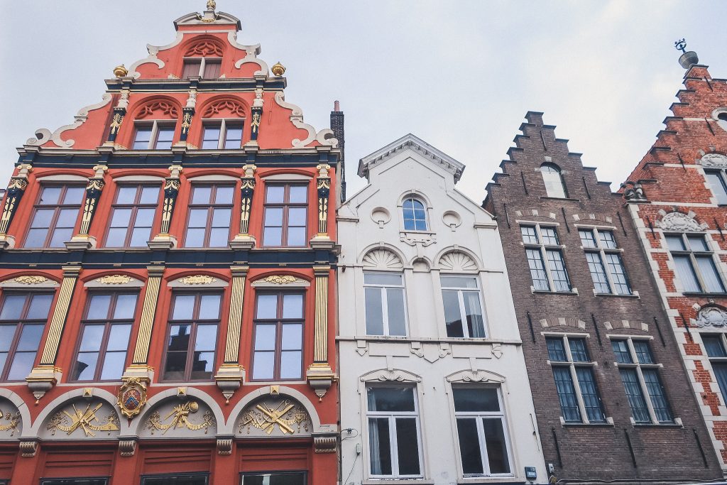 scenic facades of Bruges homes with step-gabled roofs and bright colors