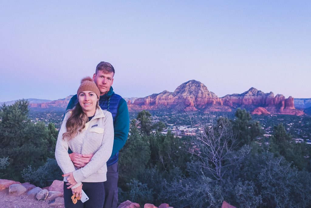 couple at Airport Mesa Scenic Lookout at sunrise