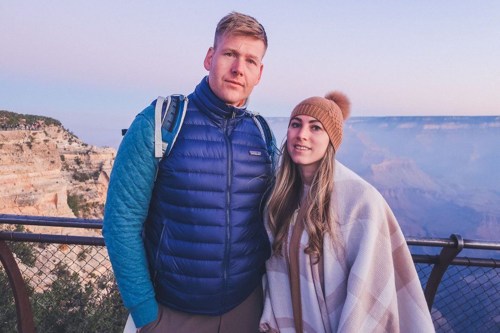 girl wears plaid poncho with fur pom hat at the grand canyon