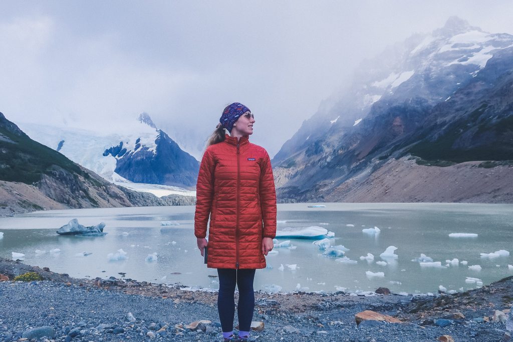 woman wears compressible jacket and thermal headband in Patagonia