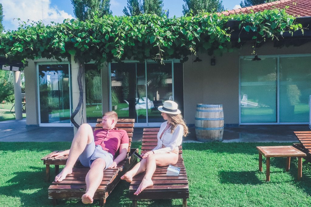 couple relaxing a Villa Mansa in Lujan de Cuyo