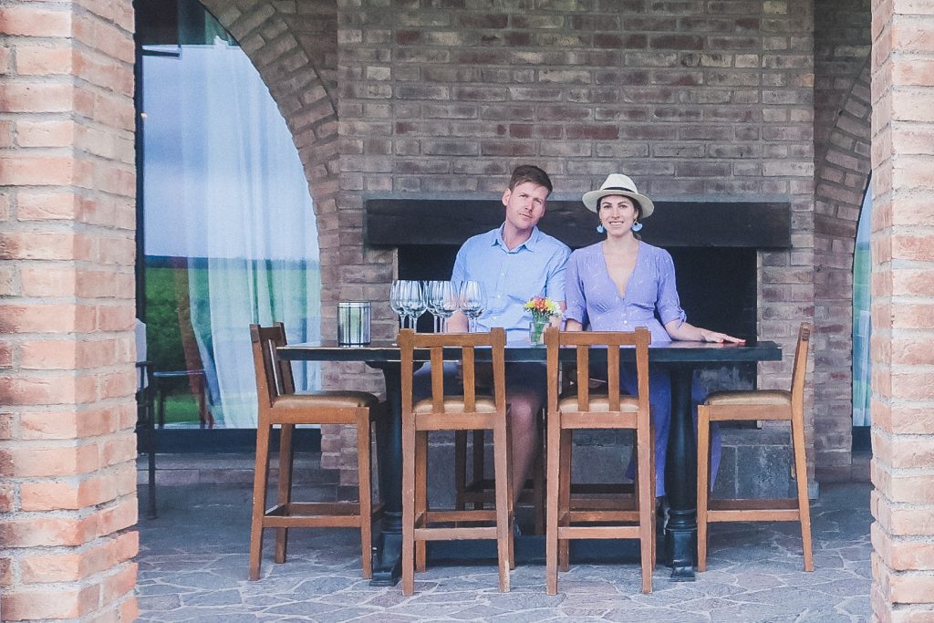 couple sits at wine tasting table in Uco Valley, Mendoza Argentina