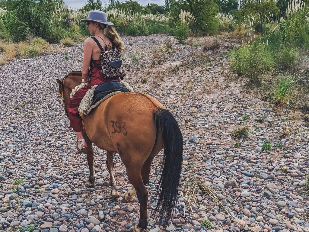girl rides horse in Lujan de Cuyo