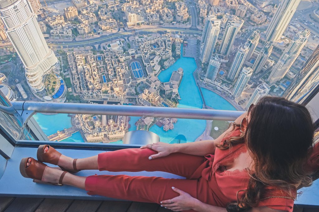 woman in Burj Khalifa wears a pink jumpsuit