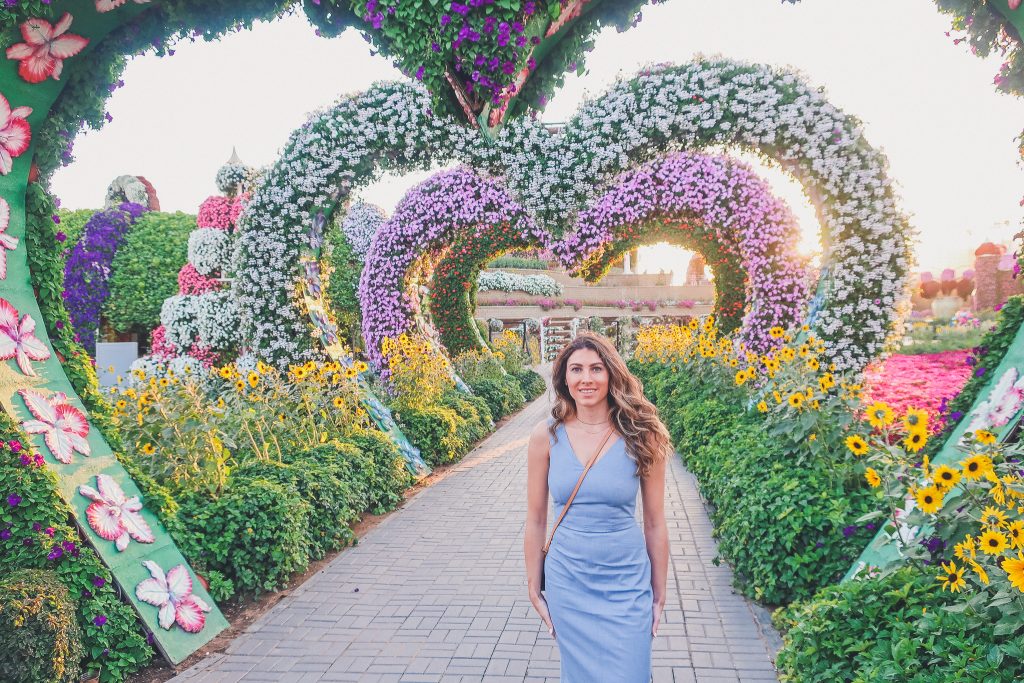 woman at Dubai Miracle Garden wears midi length dress