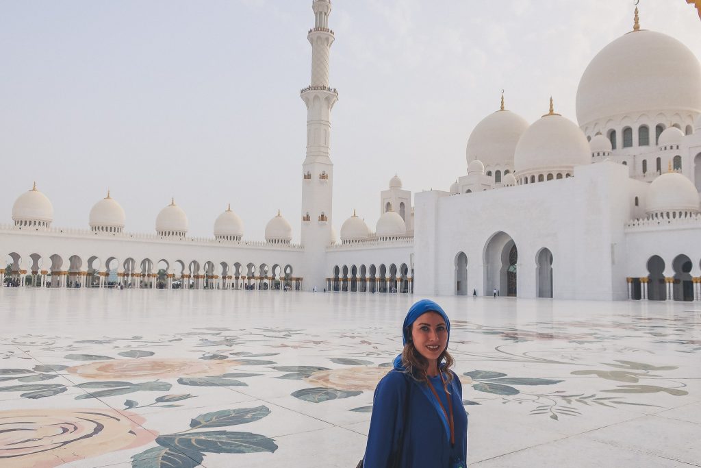 woman at Grand Mosque in Abu Dhabi wearing traditional dress