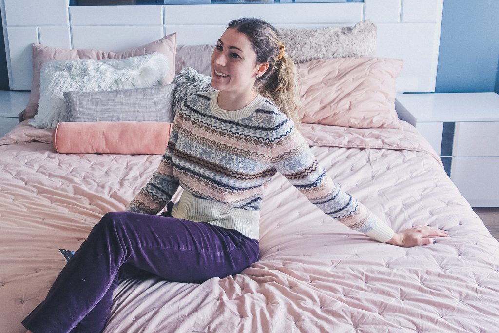 woman wears Fair Isle Christmas sweater