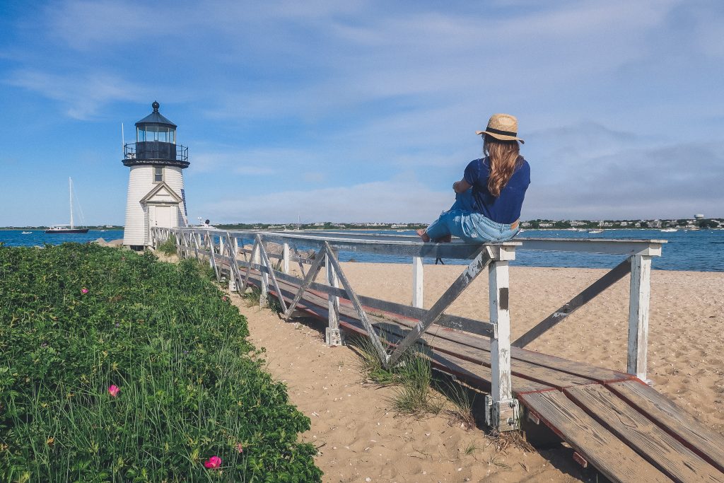 woman at Brant Point lighthouse in Nantucket