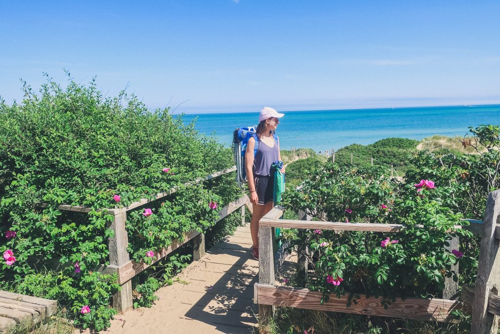 woman looks out on to Steps Beach in Nantucket