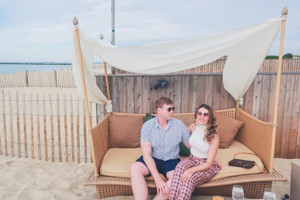 couple sits relaxing at Gallery Beach Restaurant in Nantucket