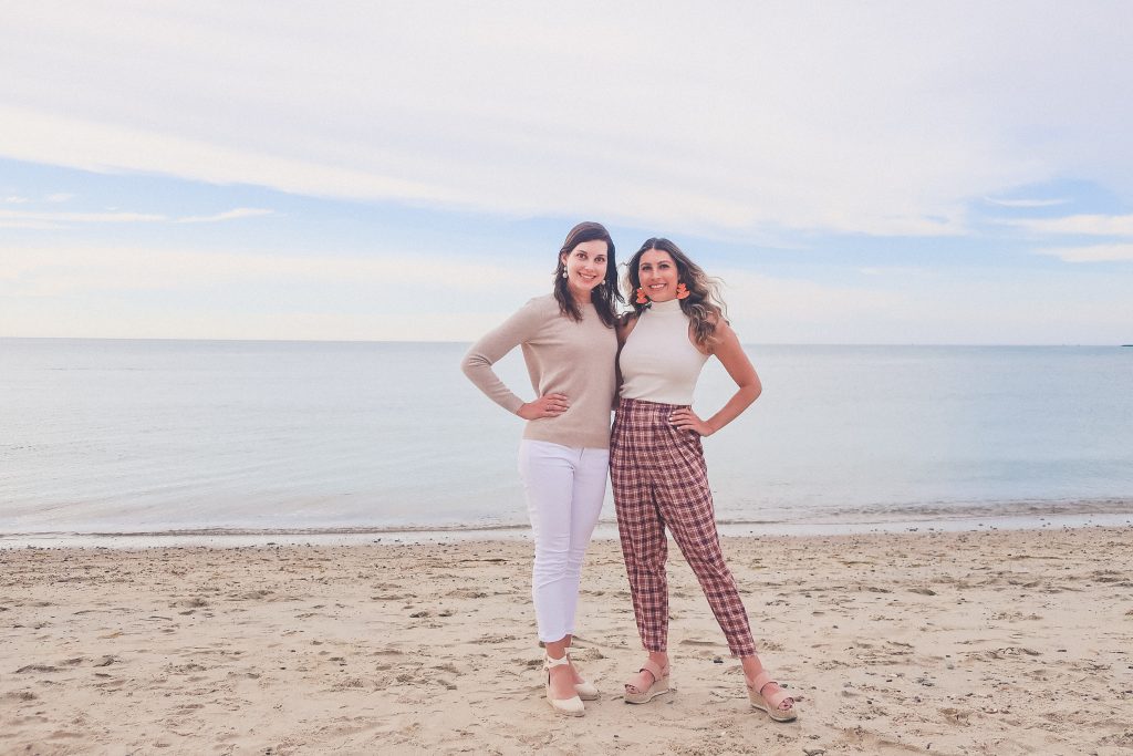 women stand on the beach next to Gallery Beach restaurant in Nantucket