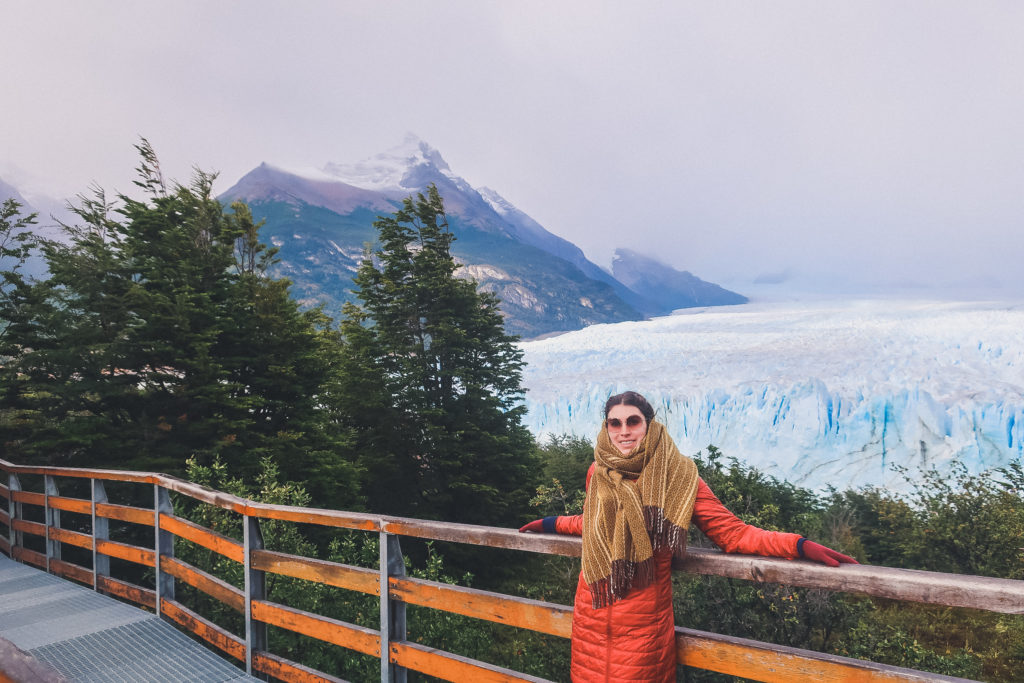 woman stands at walkways of the Perito Moreno glacier