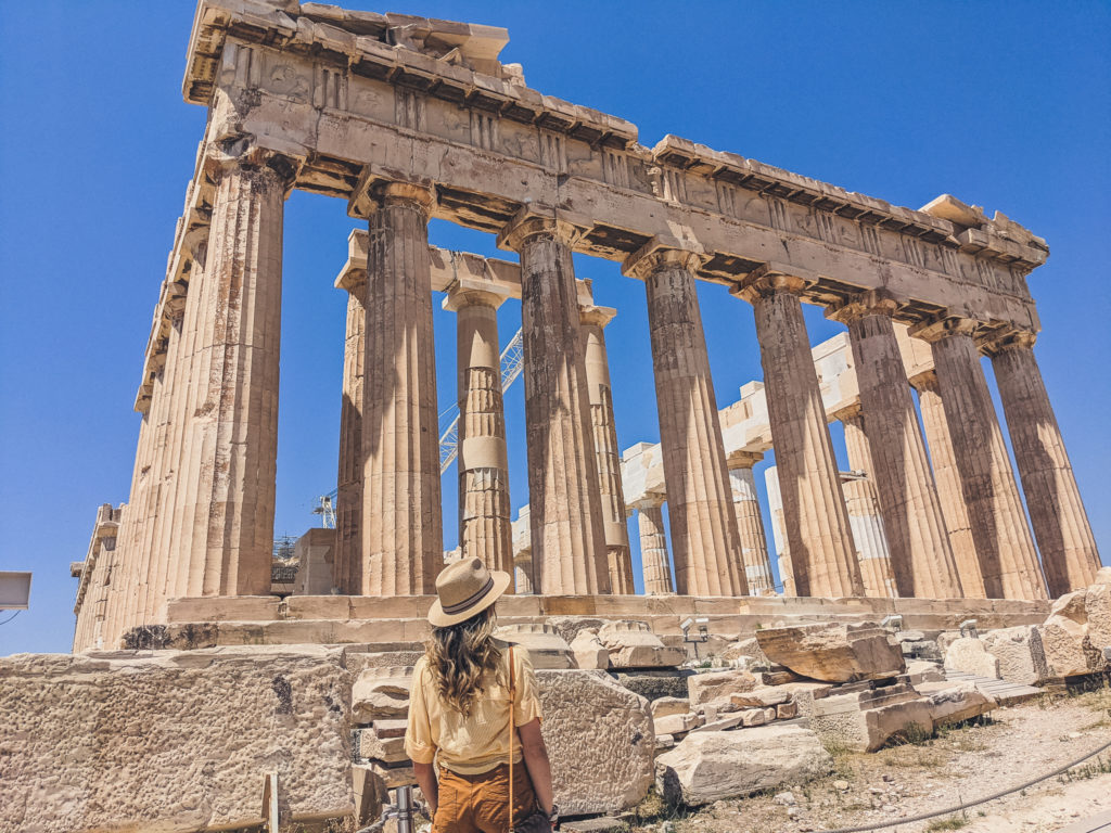 woman explores the Acropolis in Athens