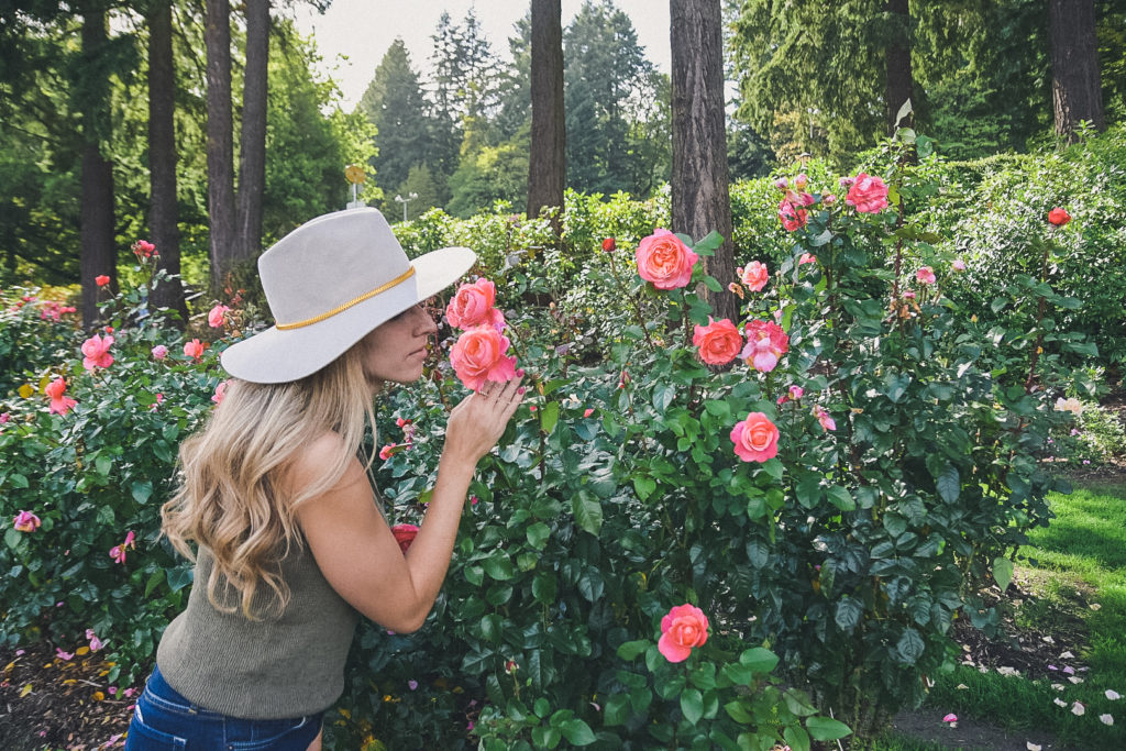 Portland Rose Garden, woman smells roses 