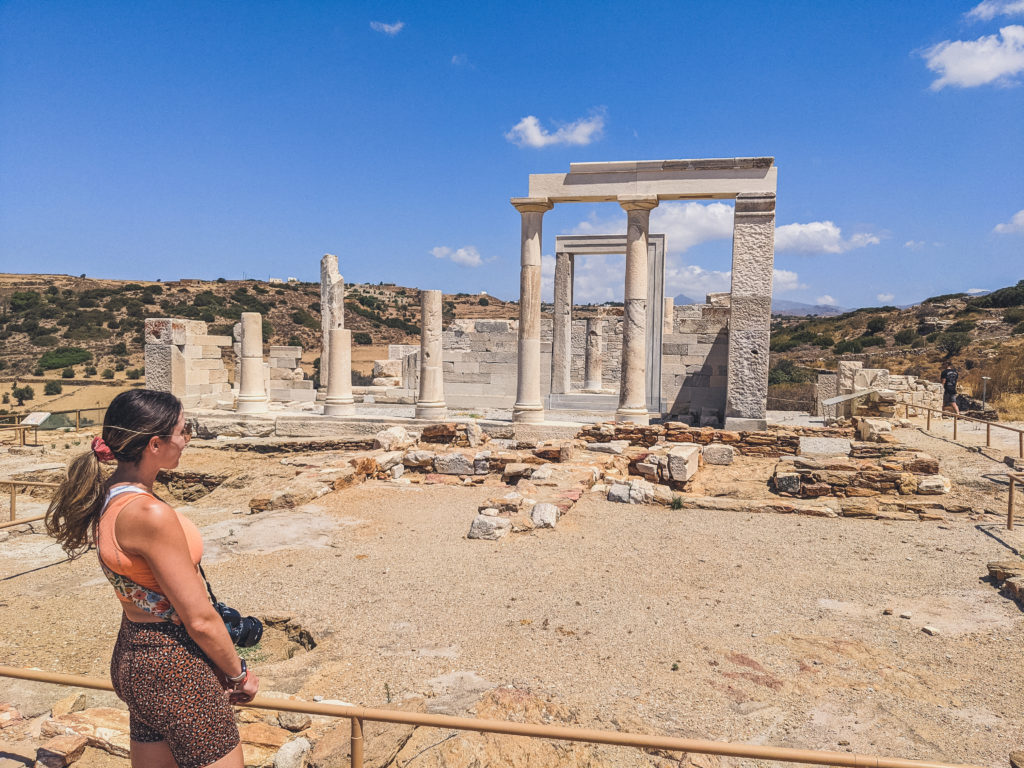 woman looking at Temple of Demeter in Naxos Greece